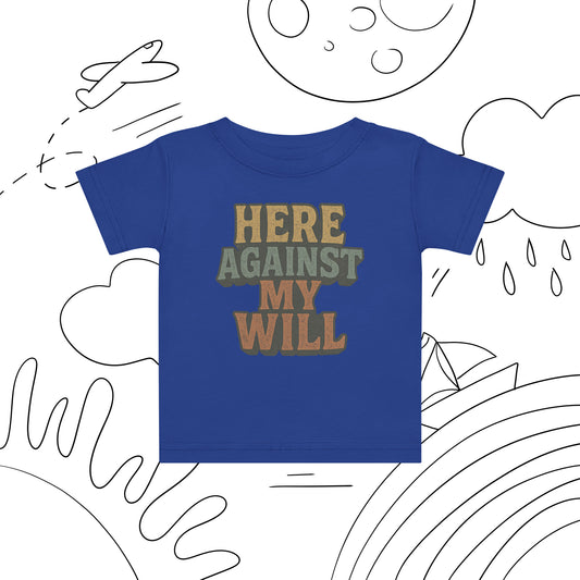 Blue t-shirt with 'HERE AGAINST MY WILL' text on a white background with black line art.