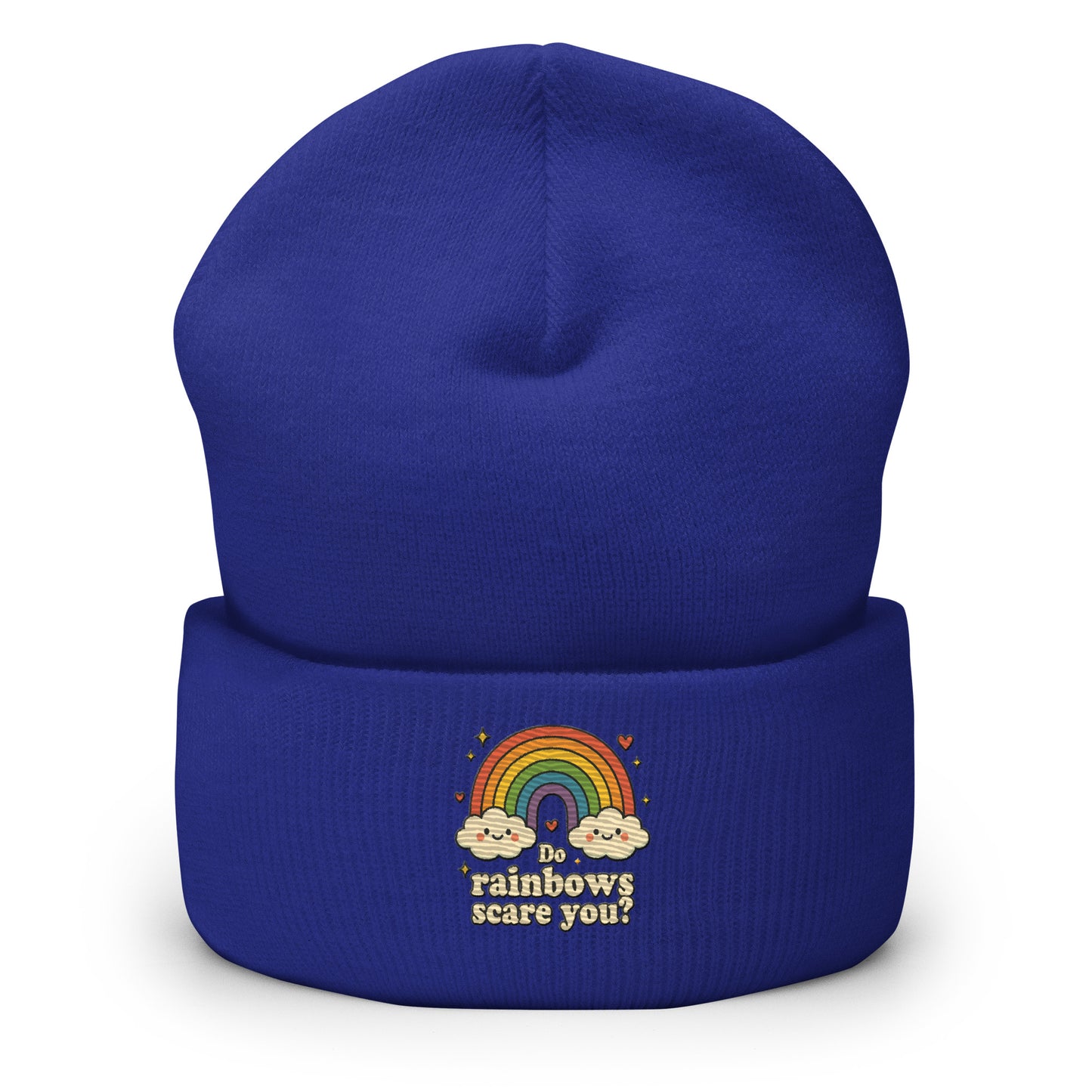 Blue beanie with rainbow and cloud design on a white background