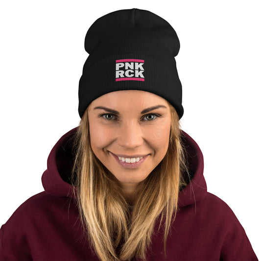 Person wearing a black beanie with 'PNK ROCK' text and a maroon hoodie on a white background