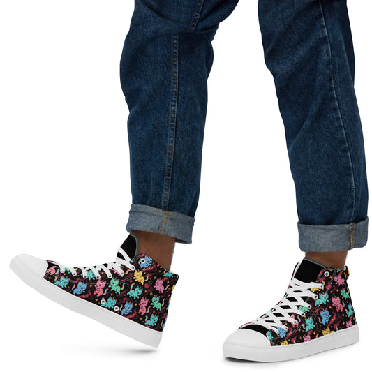 High-top sneakers with colorful pattern worn with rolled-up jeans on a white background