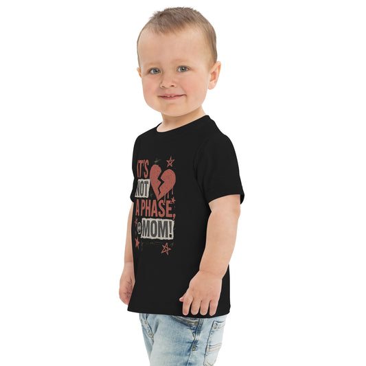 Child wearing a black t-shirt with text on a white background