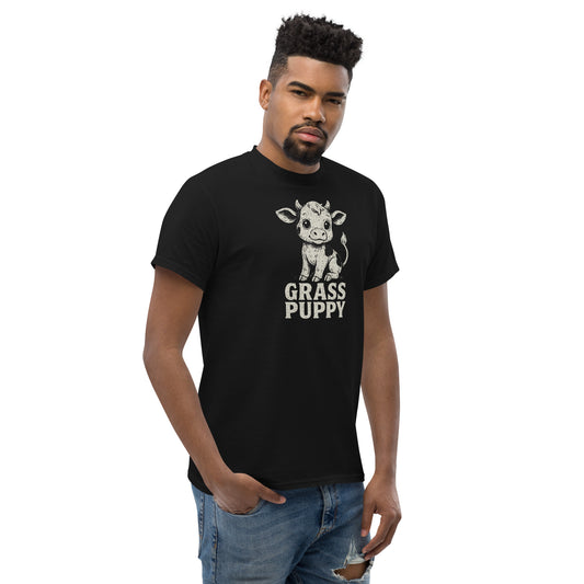 Man wearing a black t-shirt with a cow graphic and 'GRASS PUPPY' text on a white background