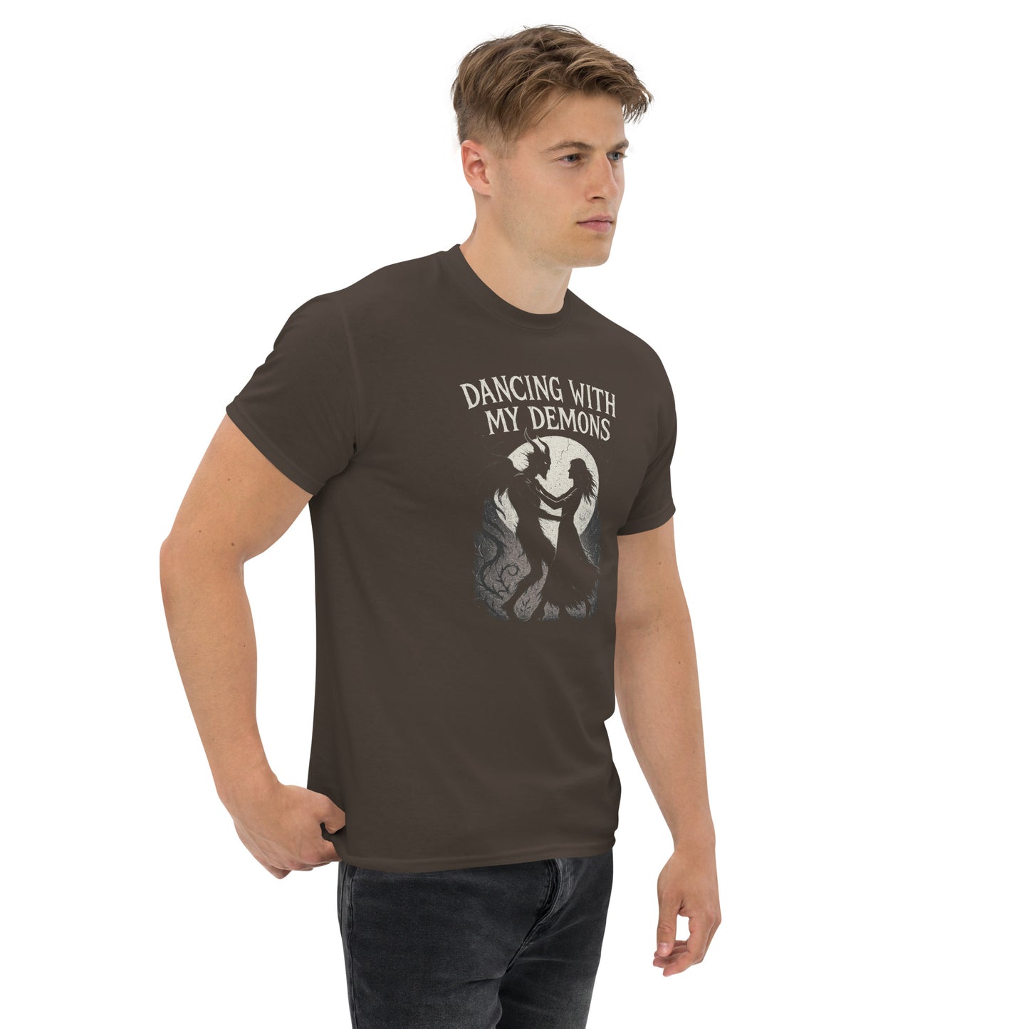 Man wearing a brown t-shirt with 'Dancing with My Demons' graphic design on a white background