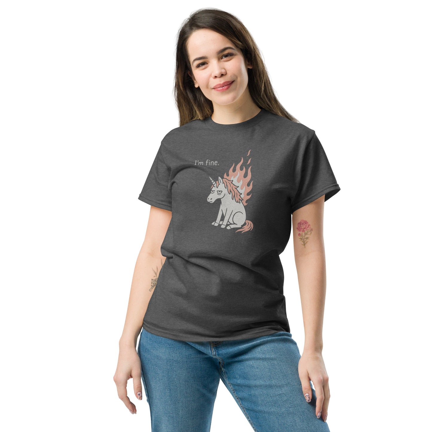 Woman wearing a dark gray t-shirt with a unicorn graphic and text on a white background