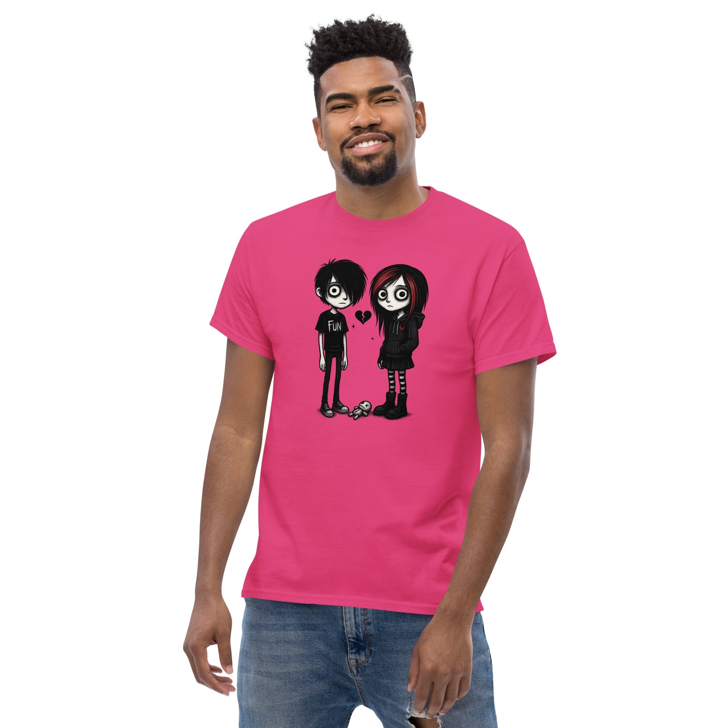 Man wearing a pink t-shirt with cartoon characters on a white background