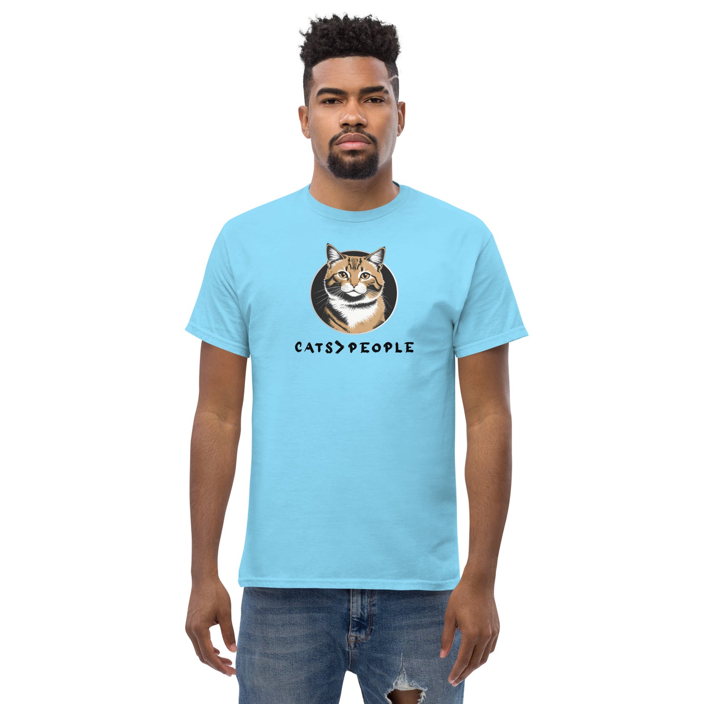 Man wearing a light blue t-shirt with a cat graphic and text on a white background