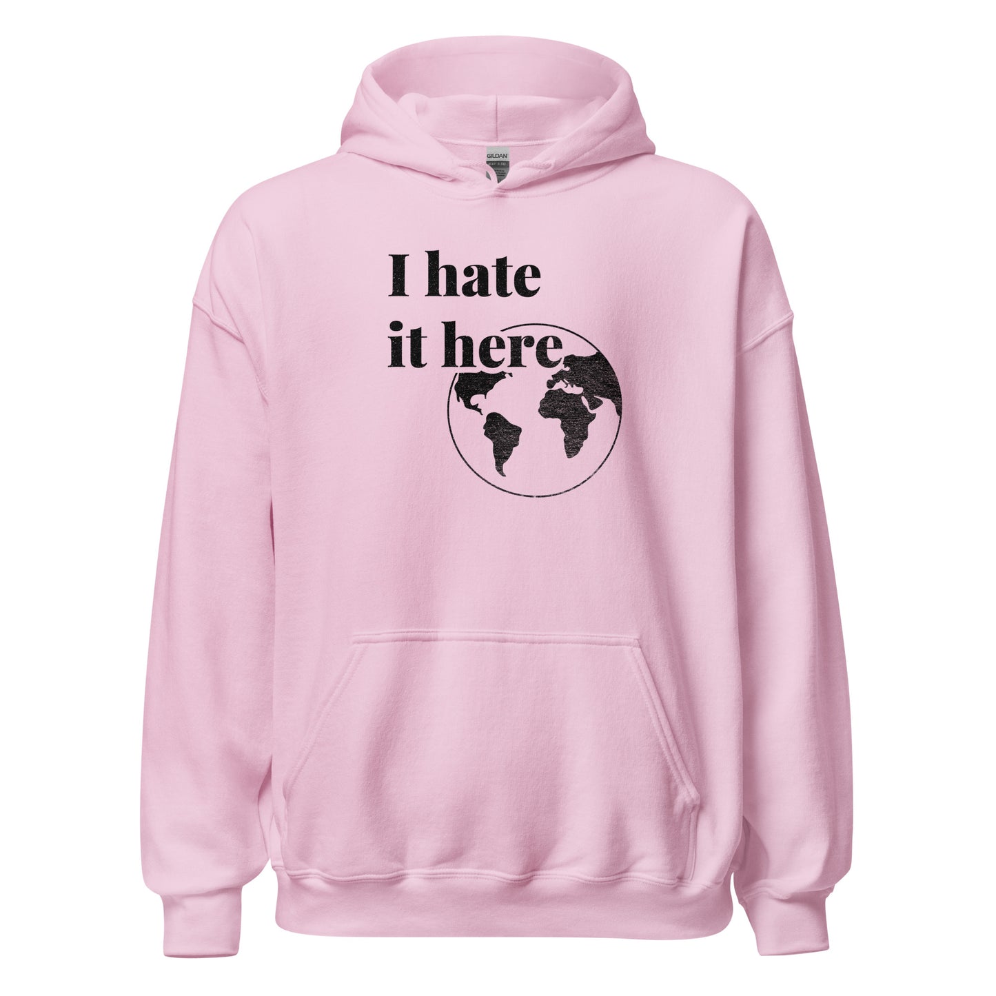 Pink hoodie with 'I hate it here' text and world map design on a white background