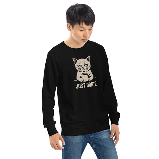 Person wearing a black sweatshirt with a cat graphic and text on a white background