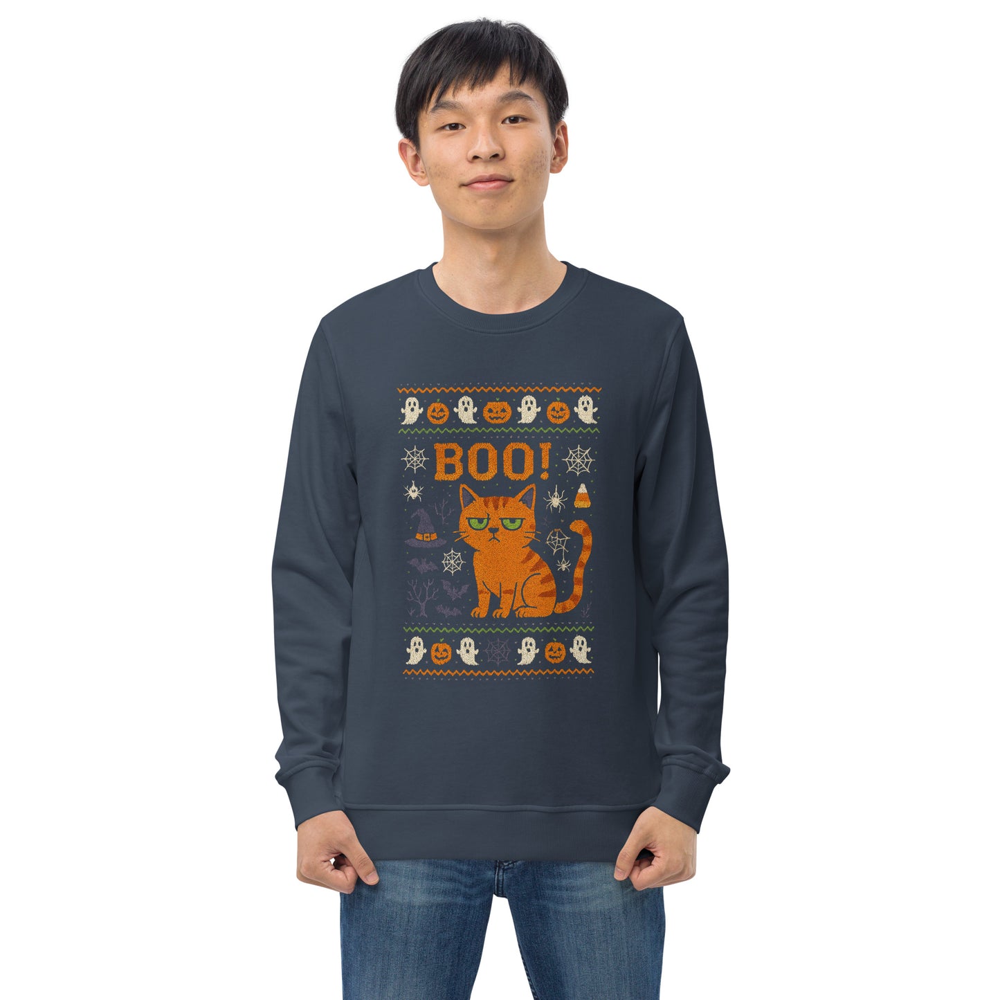 Person wearing a navy blue sweatshirt with Halloween-themed design featuring a cat and text.