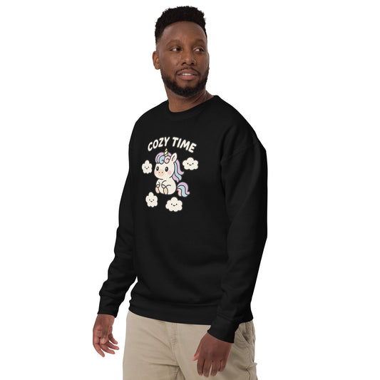Person wearing a black sweatshirt with 'Cozy Time' and unicorn design on a white background