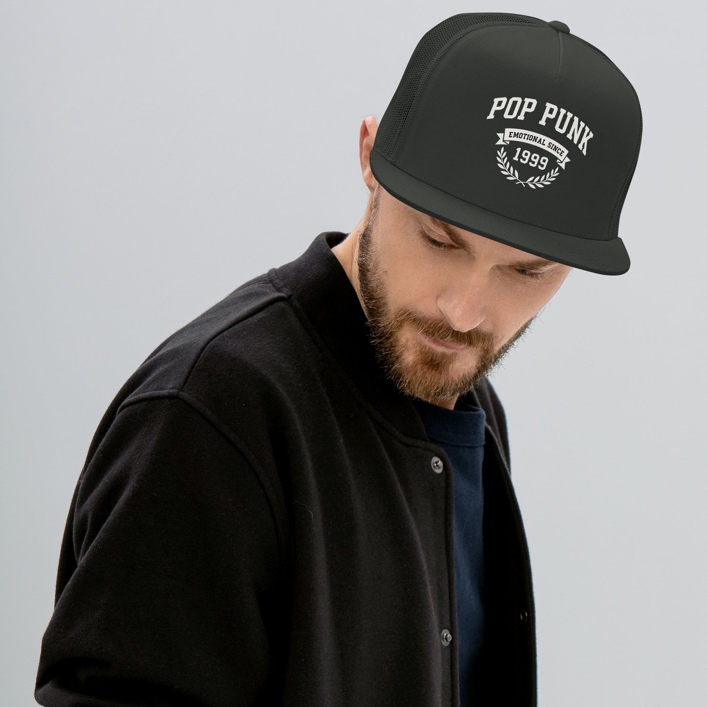 Man wearing a black cap with 'Pop Punk' text on a gray background