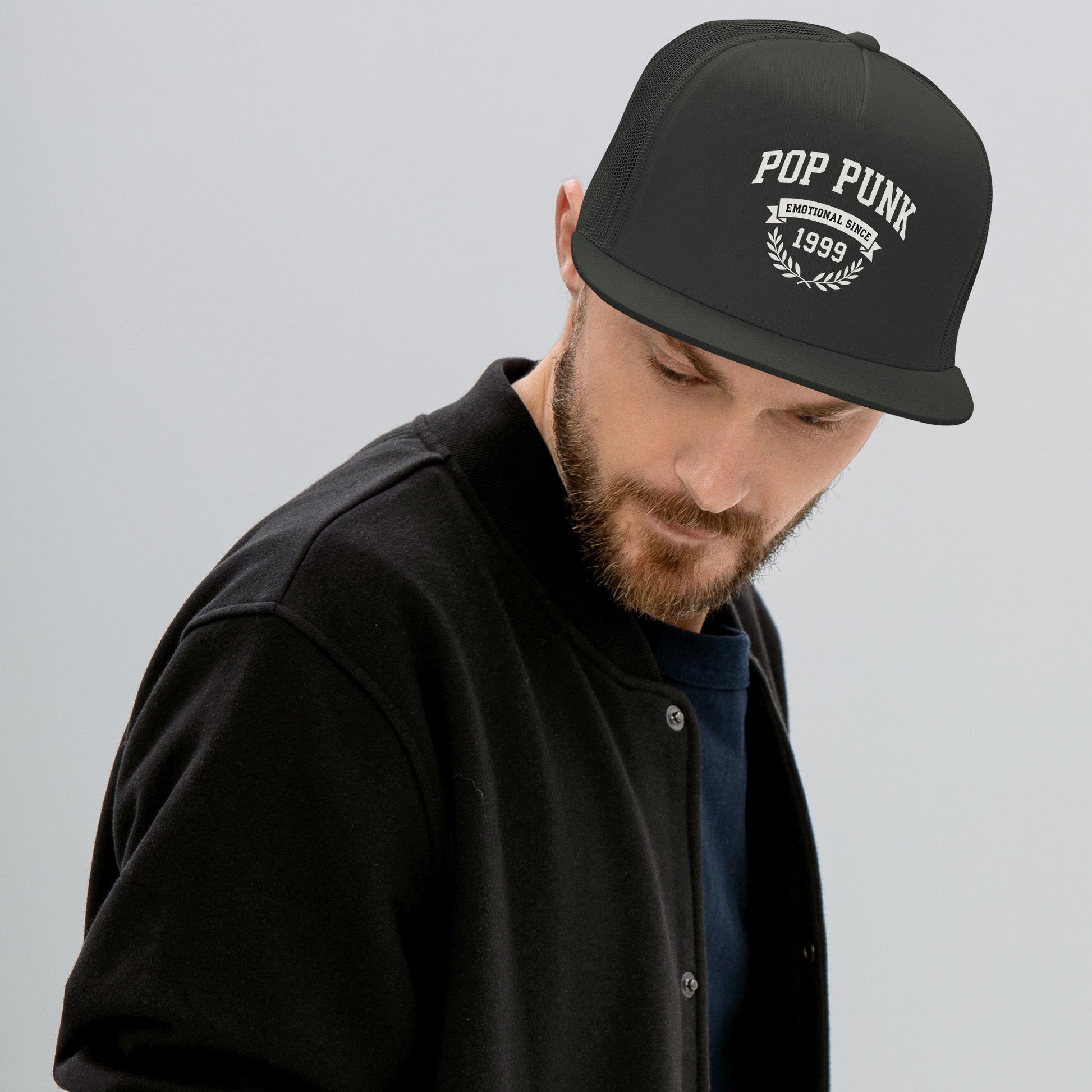 Man wearing a black cap with 'Pop Punk' text on a gray background