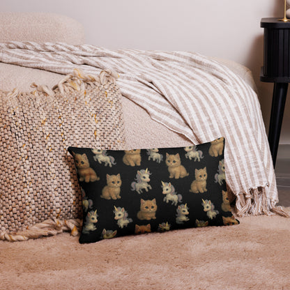 Decorative pillow with cat pattern on a bed with beige bedding and blanket.