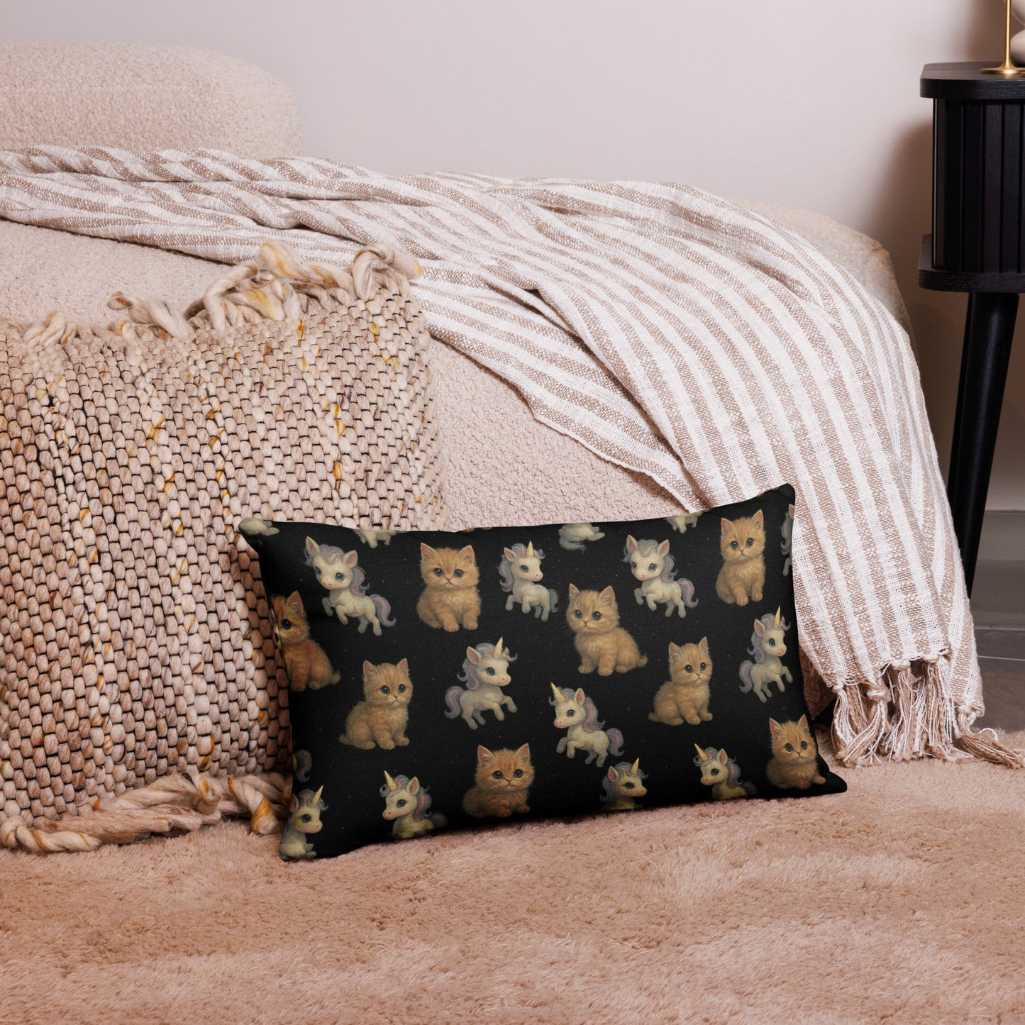 Decorative pillow with cat pattern on a bed with beige bedding