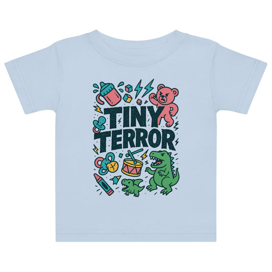Light blue t-shirt with 'Tiny Terror' graphic design featuring a bear, dinosaur, and various icons on a white background.