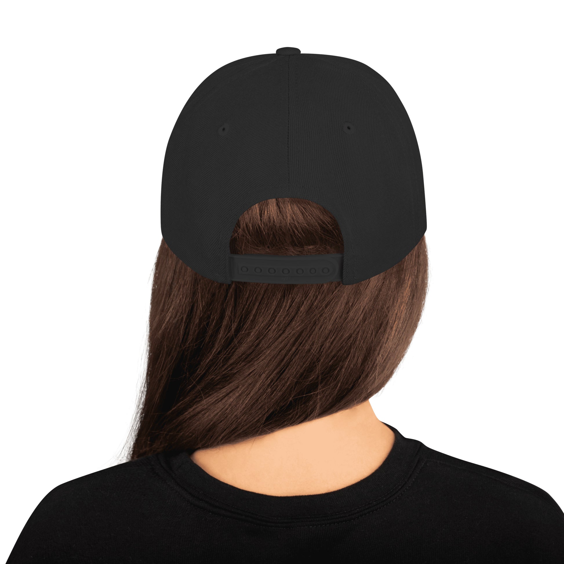 Black cap worn by a person on a white background