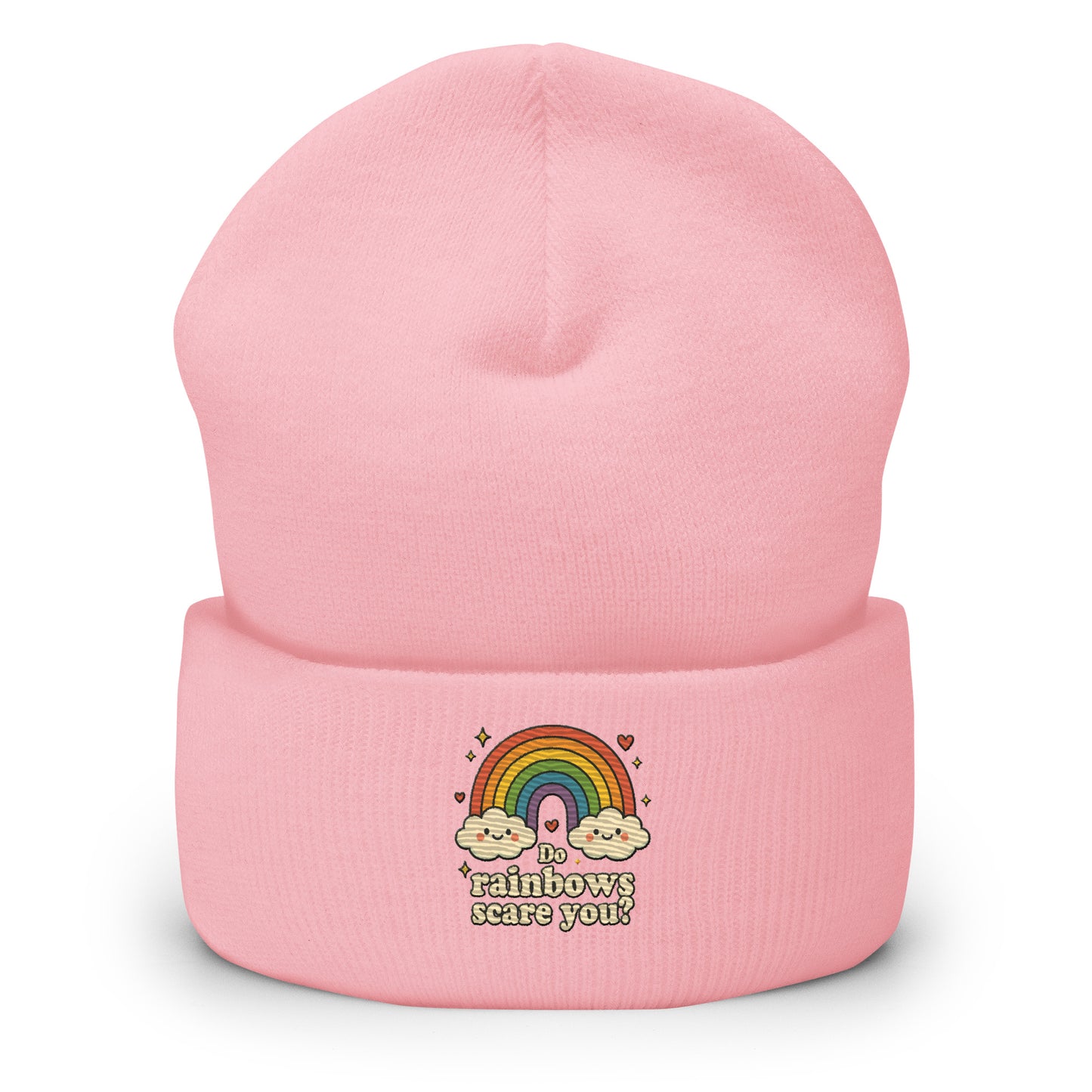 Pink beanie with rainbow and cloud design on a white background