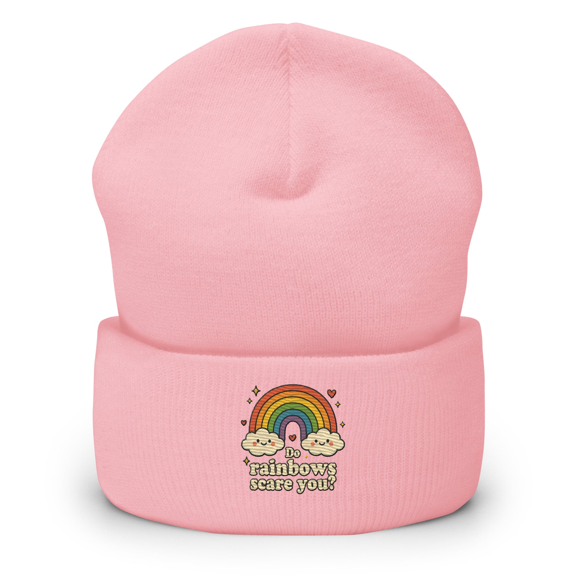 Pink beanie with rainbow and cloud design on a white background