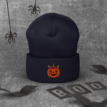 Black beanie with Halloween pumpkin design on a textured gray background with spider webs and 'BOO' letters.