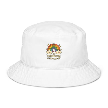 White bucket hat with rainbow and cloud design on a white background