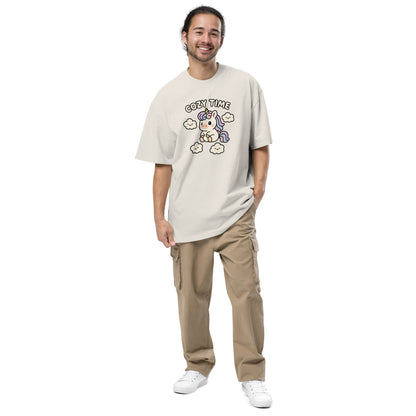 Man wearing a beige t-shirt with a graphic design on a white background