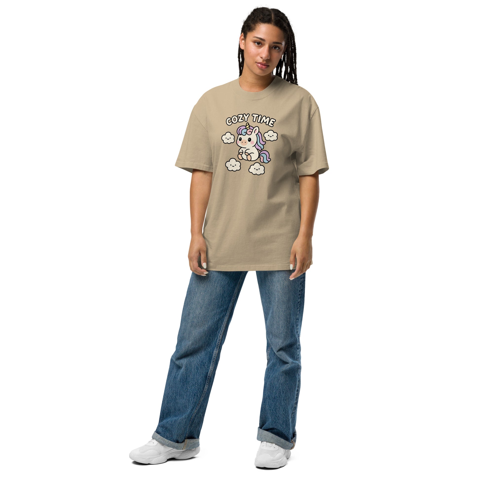 Person wearing a beige t-shirt with a graphic design on a white background