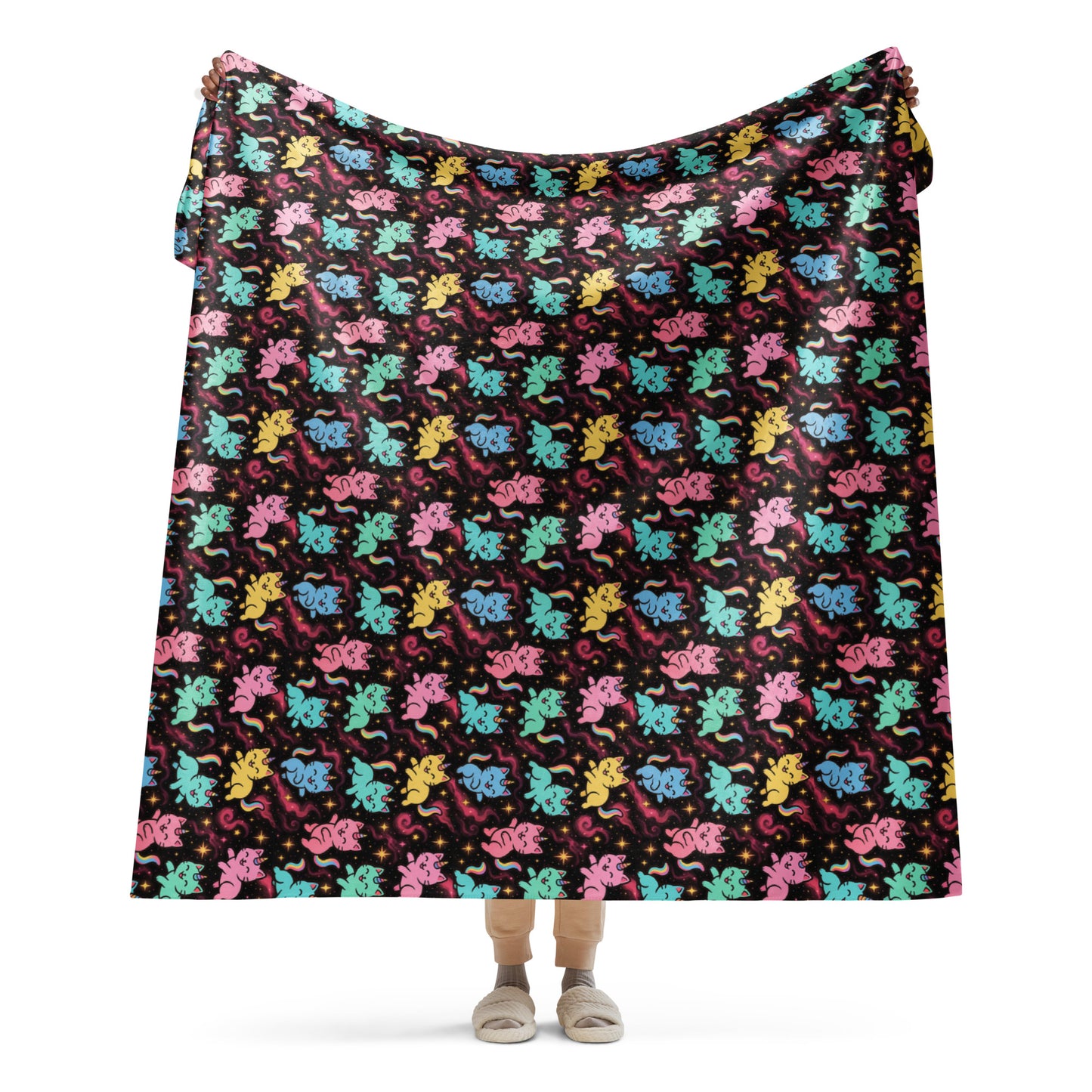 Colorful patterned blanket draped over a person on a white background