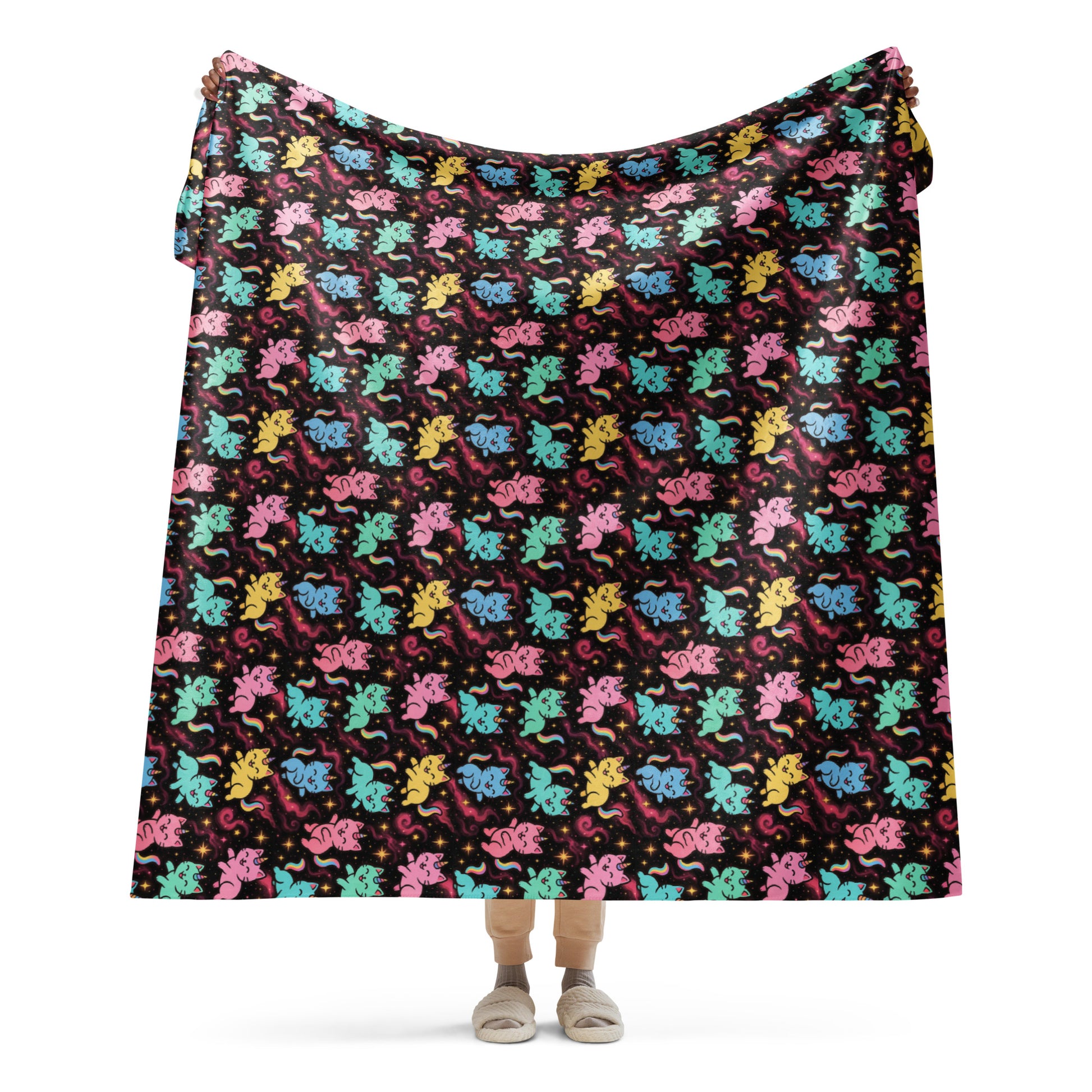 Colorful patterned blanket draped over a person on a white background