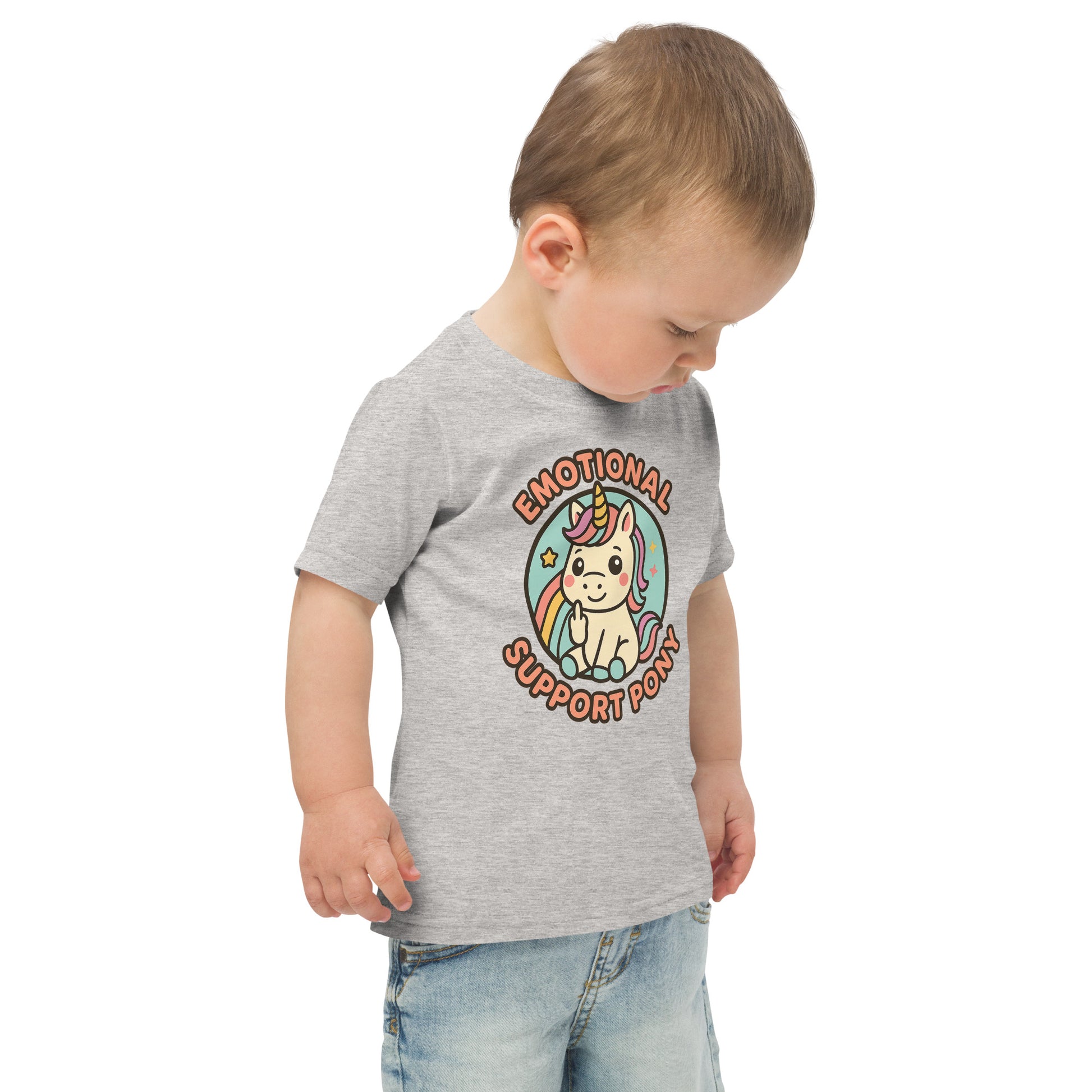 Child wearing a gray t-shirt with a unicorn graphic and text on a white background