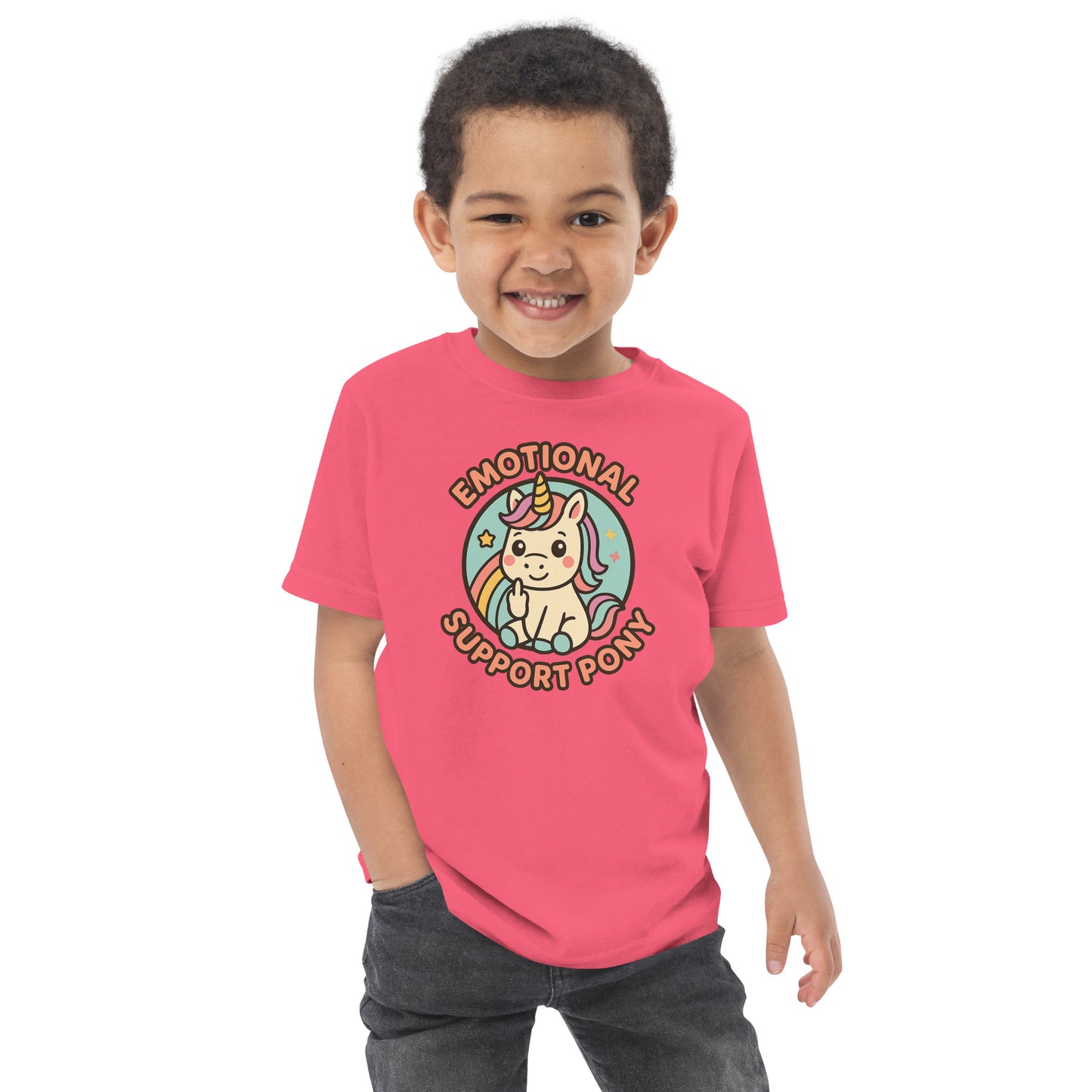 Child wearing a pink t-shirt with a unicorn graphic and text on a white background