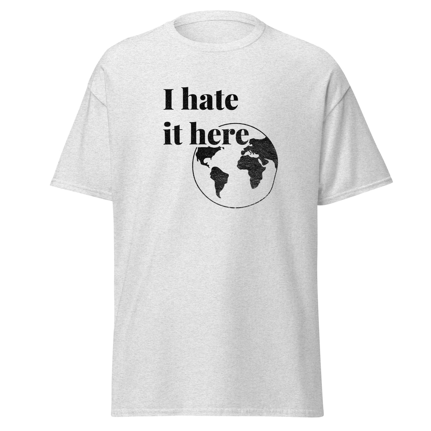 White t-shirt with 'I hate it here' text and world map graphic on a white background