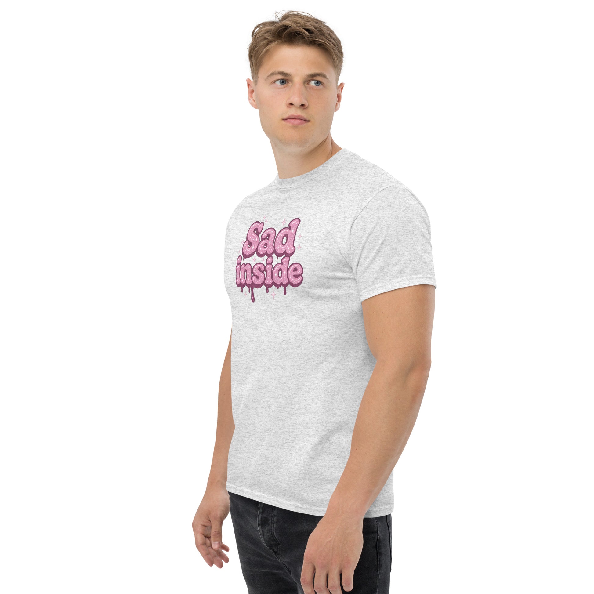 Man wearing a white t-shirt with pink text on a white background