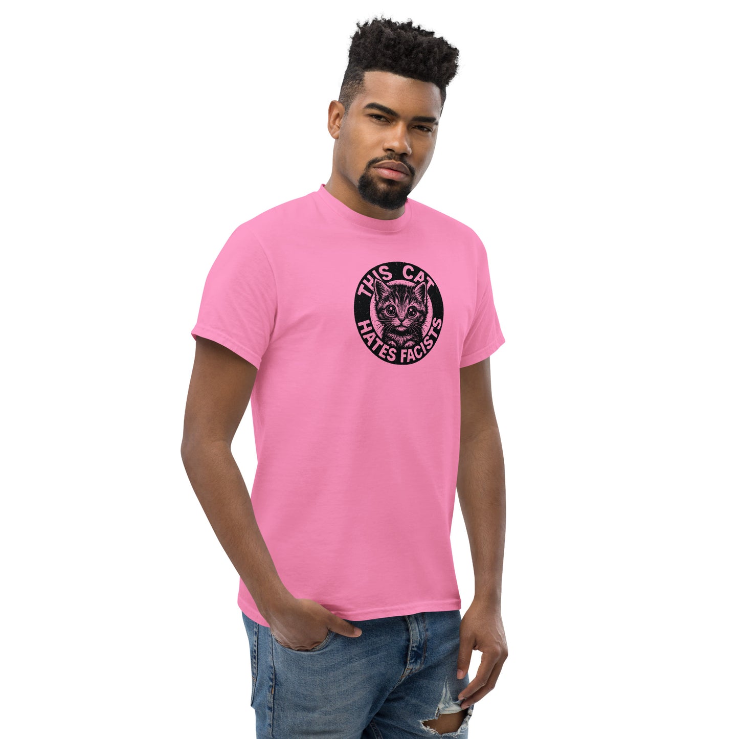Man wearing a pink t-shirt with a graphic design on a white background