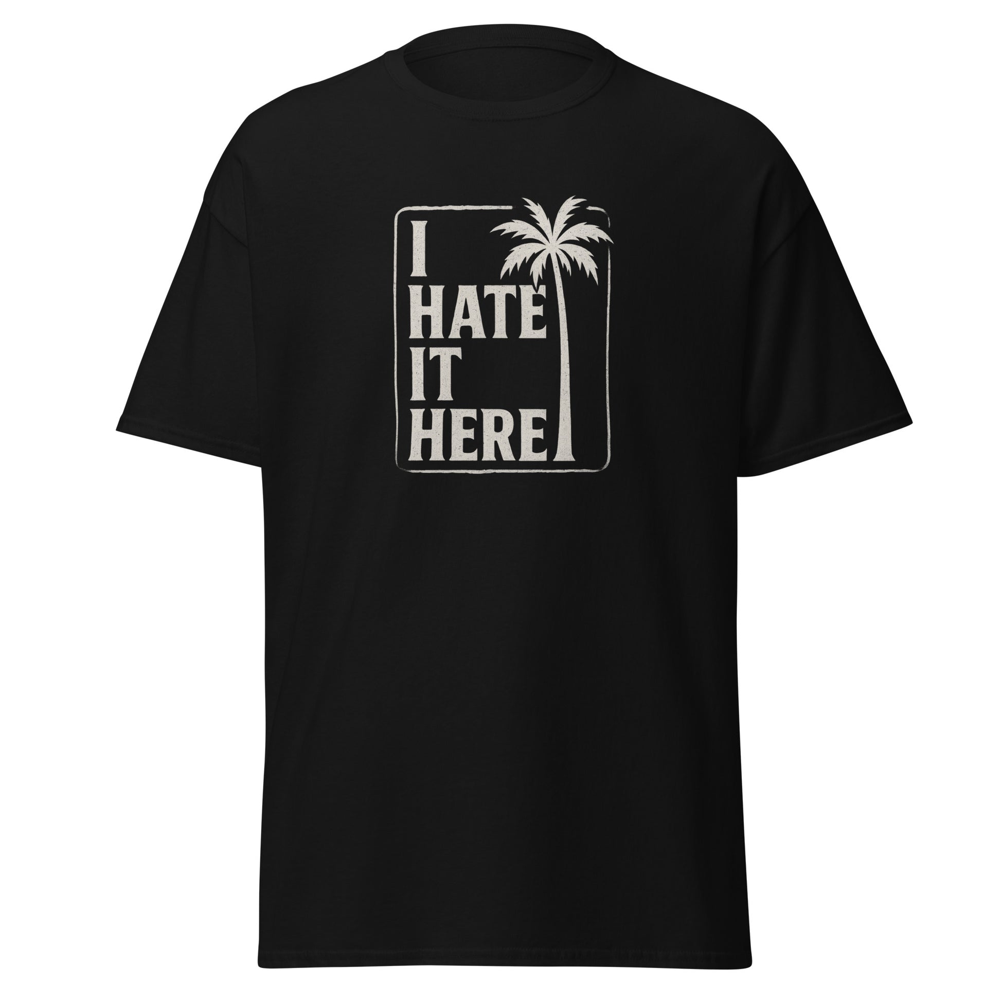 Black t-shirt with 'I Hate It Here' text and palm tree design on a white background