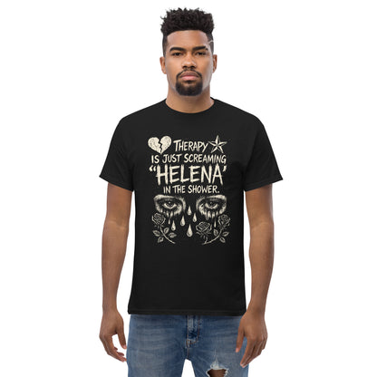 Man wearing a black t-shirt with a humorous design and text.