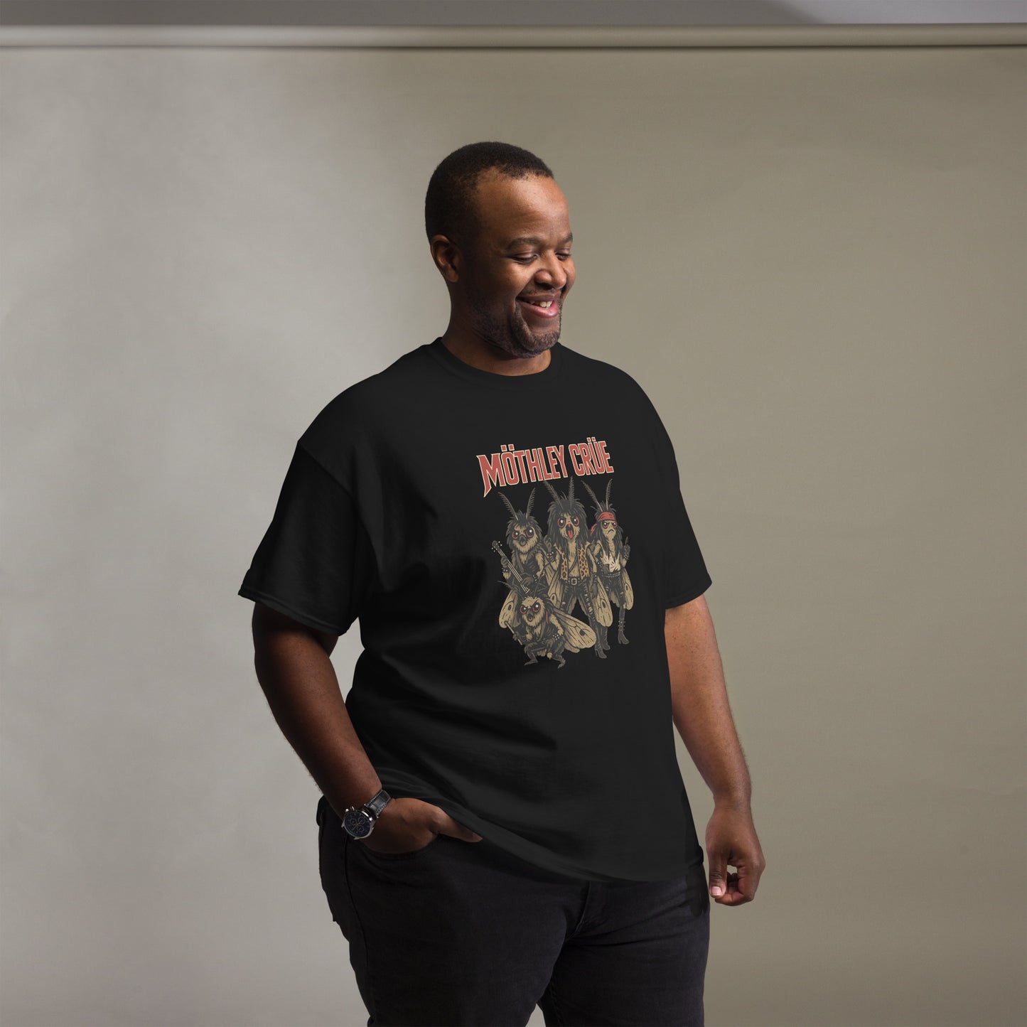 man wearing black Unisex Mothley Crüe t-shirt with chaotic rock parody design, front view
