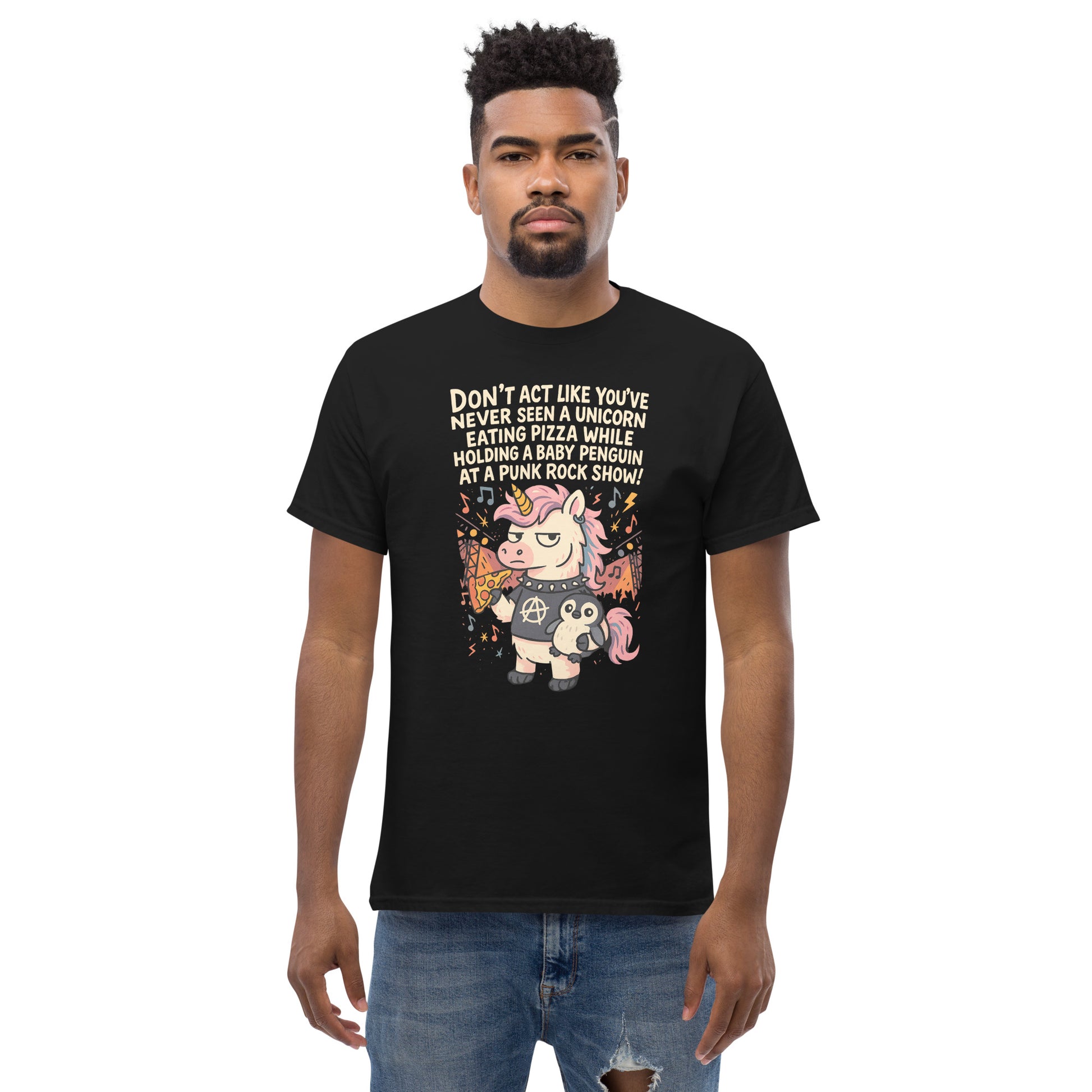 Person wearing a black t-shirt with a unicorn graphic and text on a white background