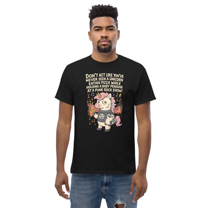 Person wearing a black t-shirt with a unicorn graphic and text on a white background