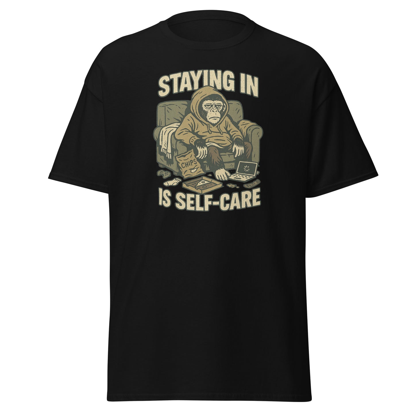 Black t-shirt with a graphic of a monkey in pajamas and text 'STAYING IN IS SELF-CARE' on a white background.