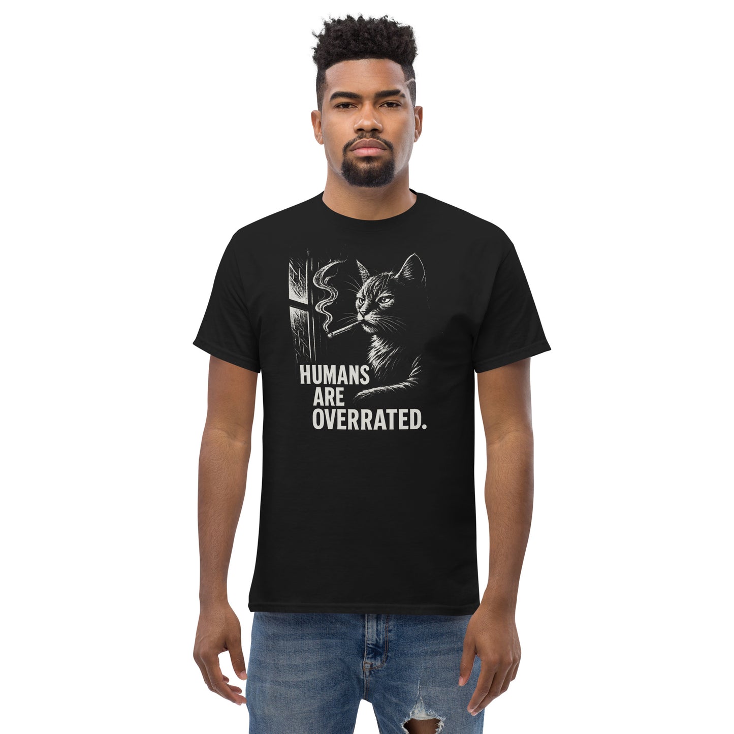 Man wearing a black t-shirt with a cat graphic and text on a white background