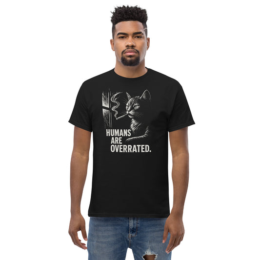 Man wearing a black t-shirt with a cat graphic and text on a white background