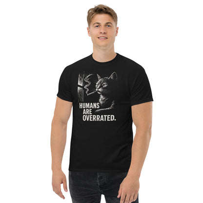 Person wearing a black t-shirt with a cat graphic and text on a white background