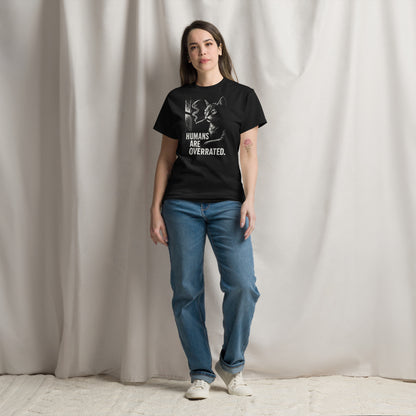 Person wearing a black t-shirt with a graphic and text, standing against a plain background