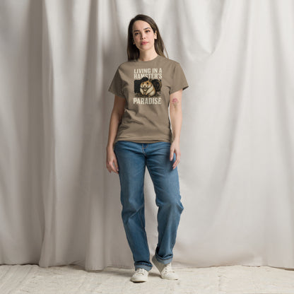 Person wearing a brown t-shirt with a graphic and text, standing against a plain background