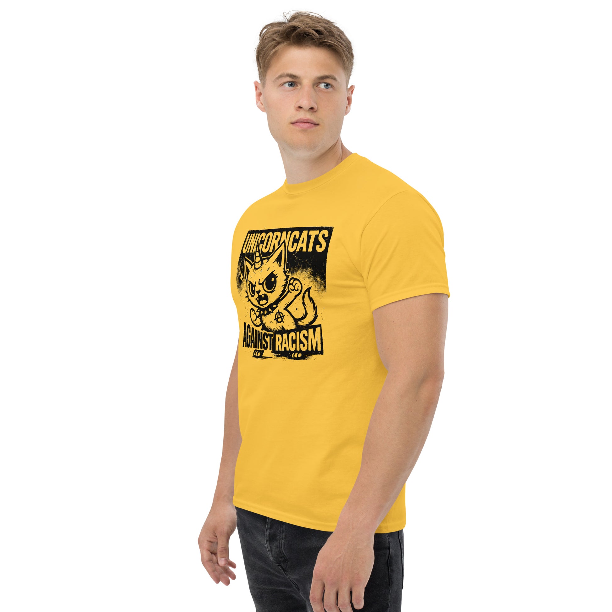 Person wearing yellow shirt with a unicorncat and the slogan "Unicorncats against racism"