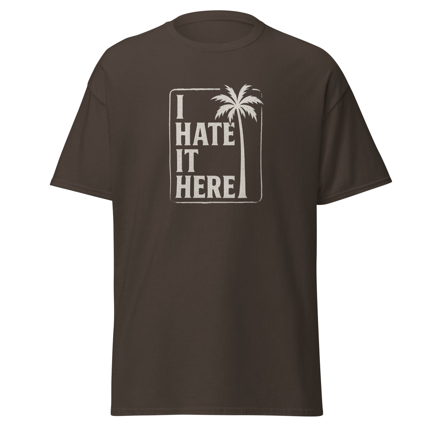 Brown t-shirt with 'I Hate It Here' graphic on a white background