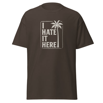 Brown t-shirt with 'I Hate It Here' graphic on a white background
