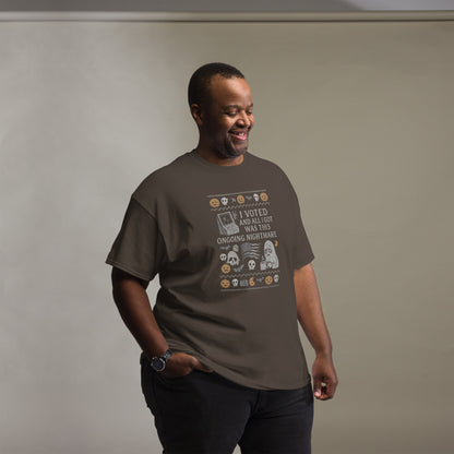Man wearing a brown t-shirt with a graphic design on a plain background