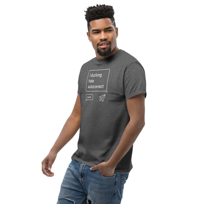 Man wearing a dark gray t-shirt with text and graphics on a white background
