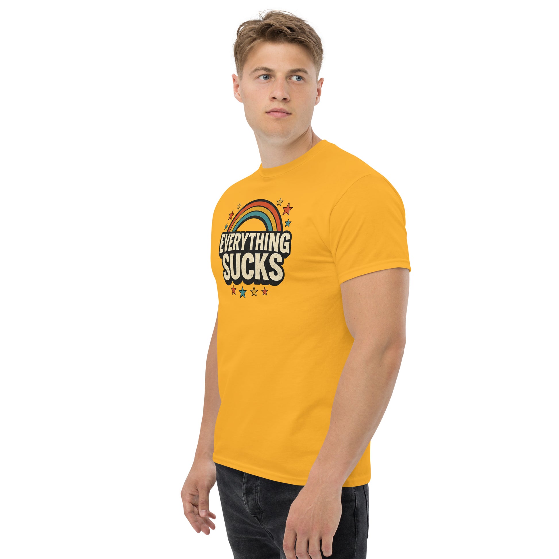 Man wearing a yellow t-shirt with 'Everything Sucks' graphic on a white background
